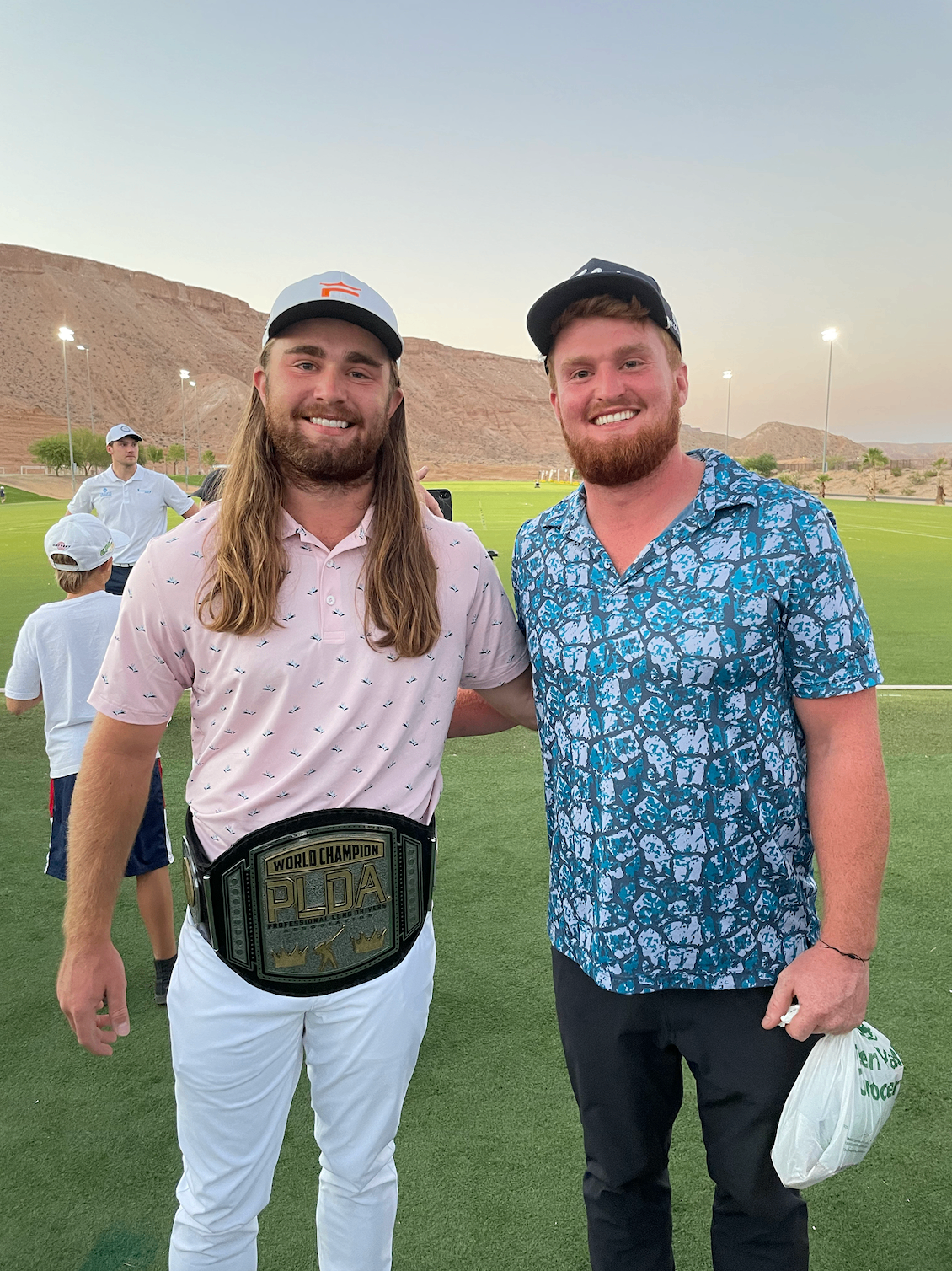 Stephen Hopper alongside the PLDA world champion belt at a long drive event